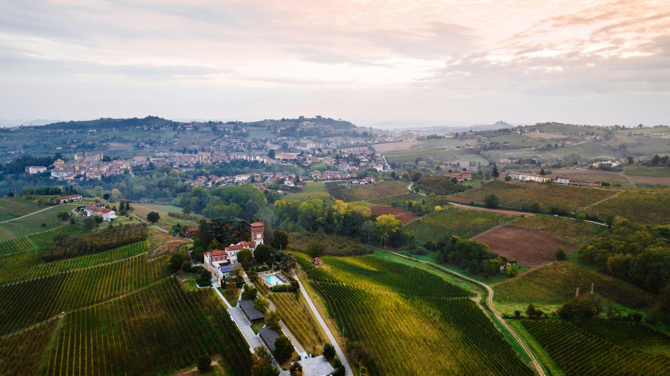Scenic aerial view of vineyards and rural landscape in Piemonte, Italy.